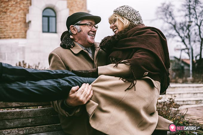 OurTime reviews: a man holding a woman.